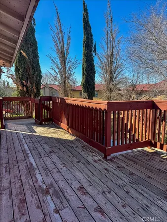 a view of balcony with wooden floor