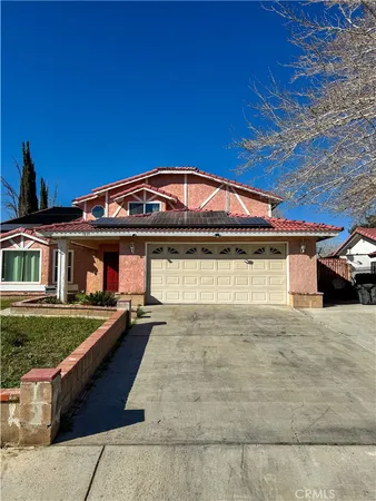 a front view of a house with yard
