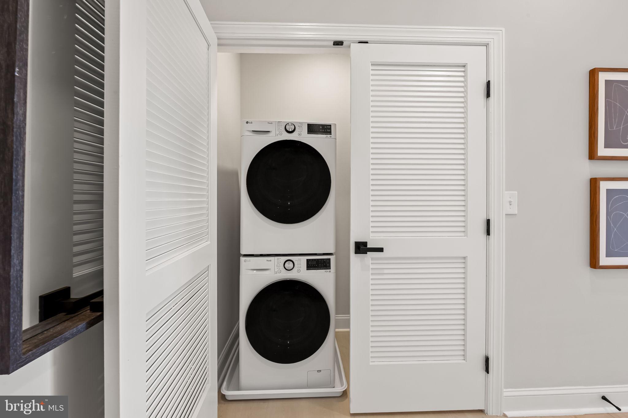 600 North Howard Street, Unit 101 Baltimore, MD 21201 - Photo 14 of 36 a view of a hallway with washer and dryer