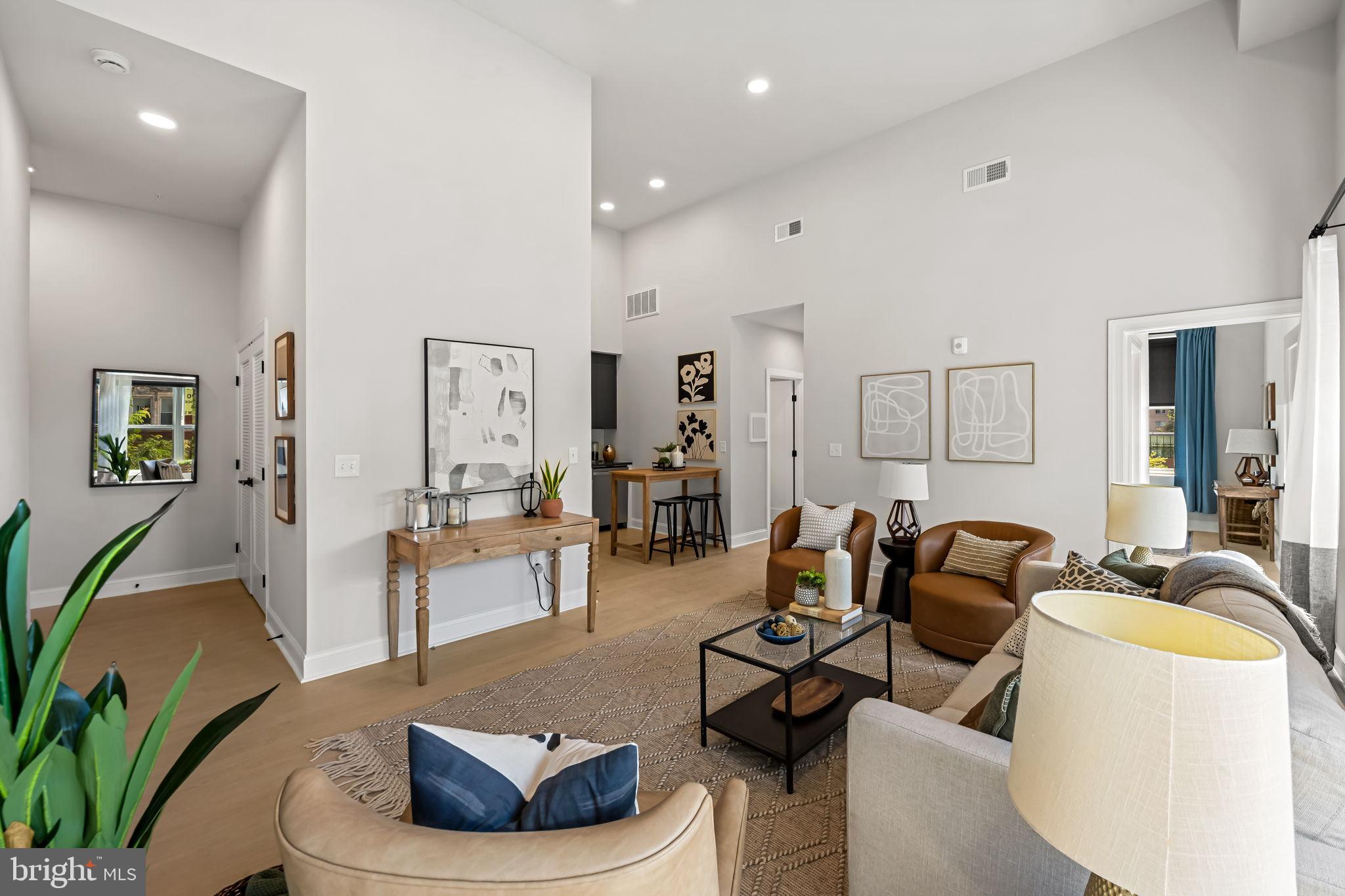 600 North Howard Street, Unit 101 Baltimore, MD 21201 - Photo 3 of 20 a living room with furniture and a wooden floor