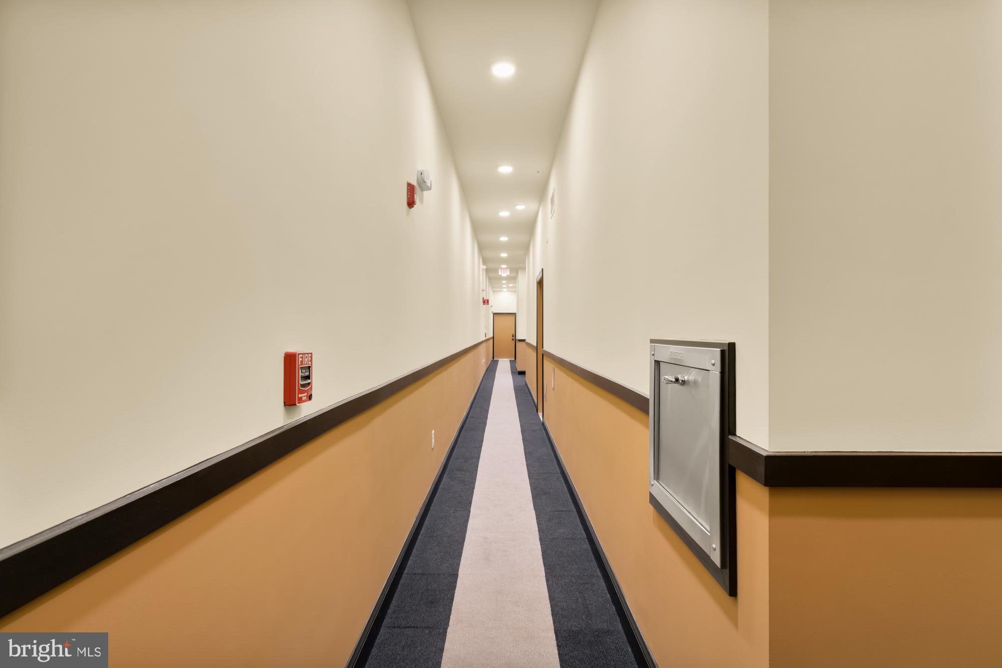 600 North Howard Street, Unit 101 Baltimore, MD 21201 - Photo 31 of 36 a view of a hallway with wooden floor