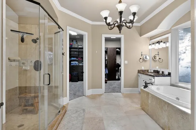 a view of a bathroom with a tub shower and mirror