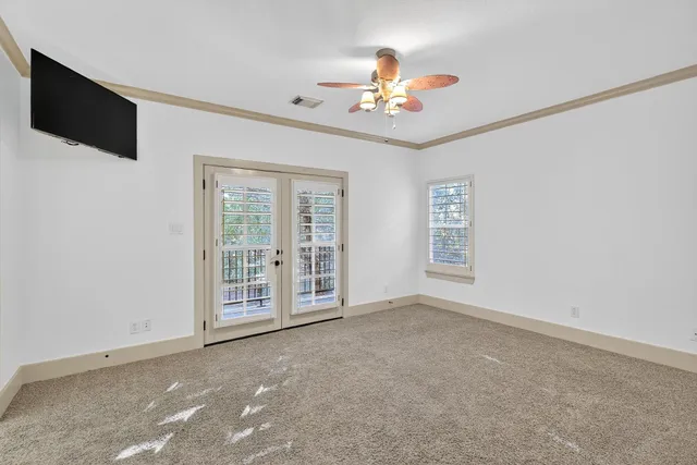a bathroom with a granite countertop sink a toilet a mirror a vanity and shower