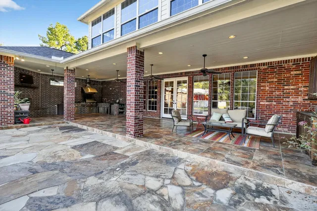 a view of a fountain with large trees