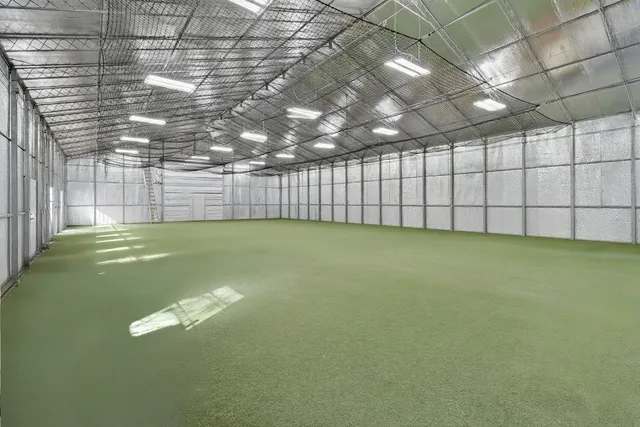 a bathroom with a sink a toilet a shower and a mirror