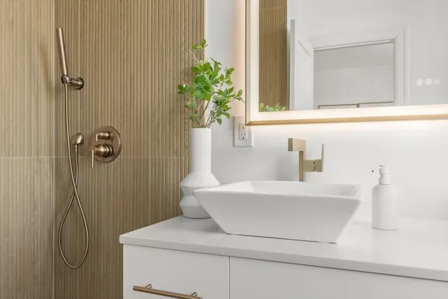 a bathroom with a sink and a mirror