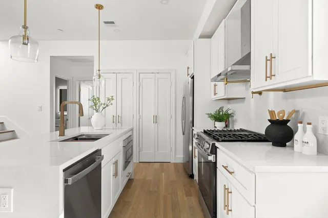 a kitchen with a sink and stove