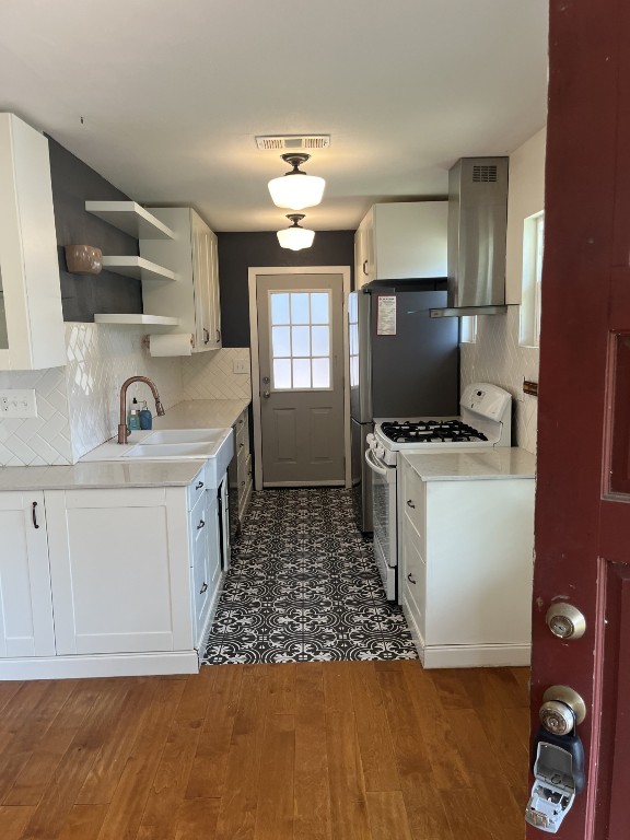 4613 Munson Street Austin, TX 78721 - Photo 1 of 1 a kitchen with a sink appliances and cabinets