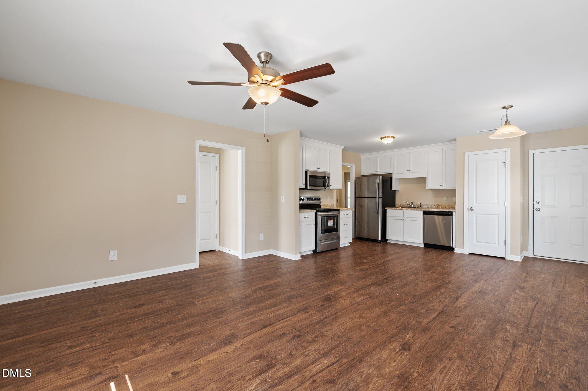 597 Pendergraft Road Bunnlevel, NC 28323 - Photo 4 of 21 a view of empty room with wooden floor and window