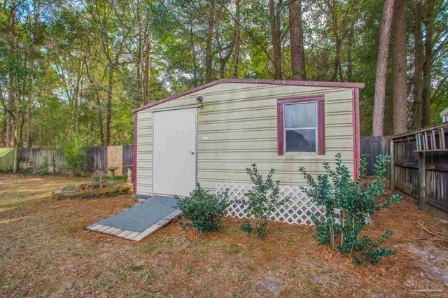 a room with pool table and glass windows