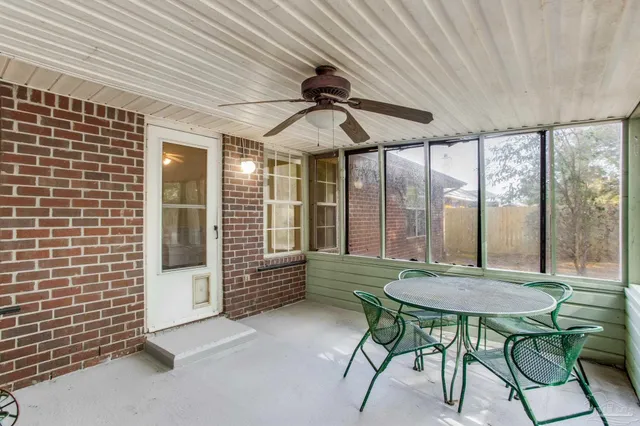 a spacious bedroom with a bed and a table