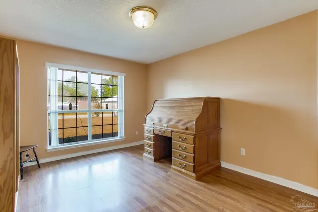 a kitchen with a sink a stove a refrigerator and cabinets