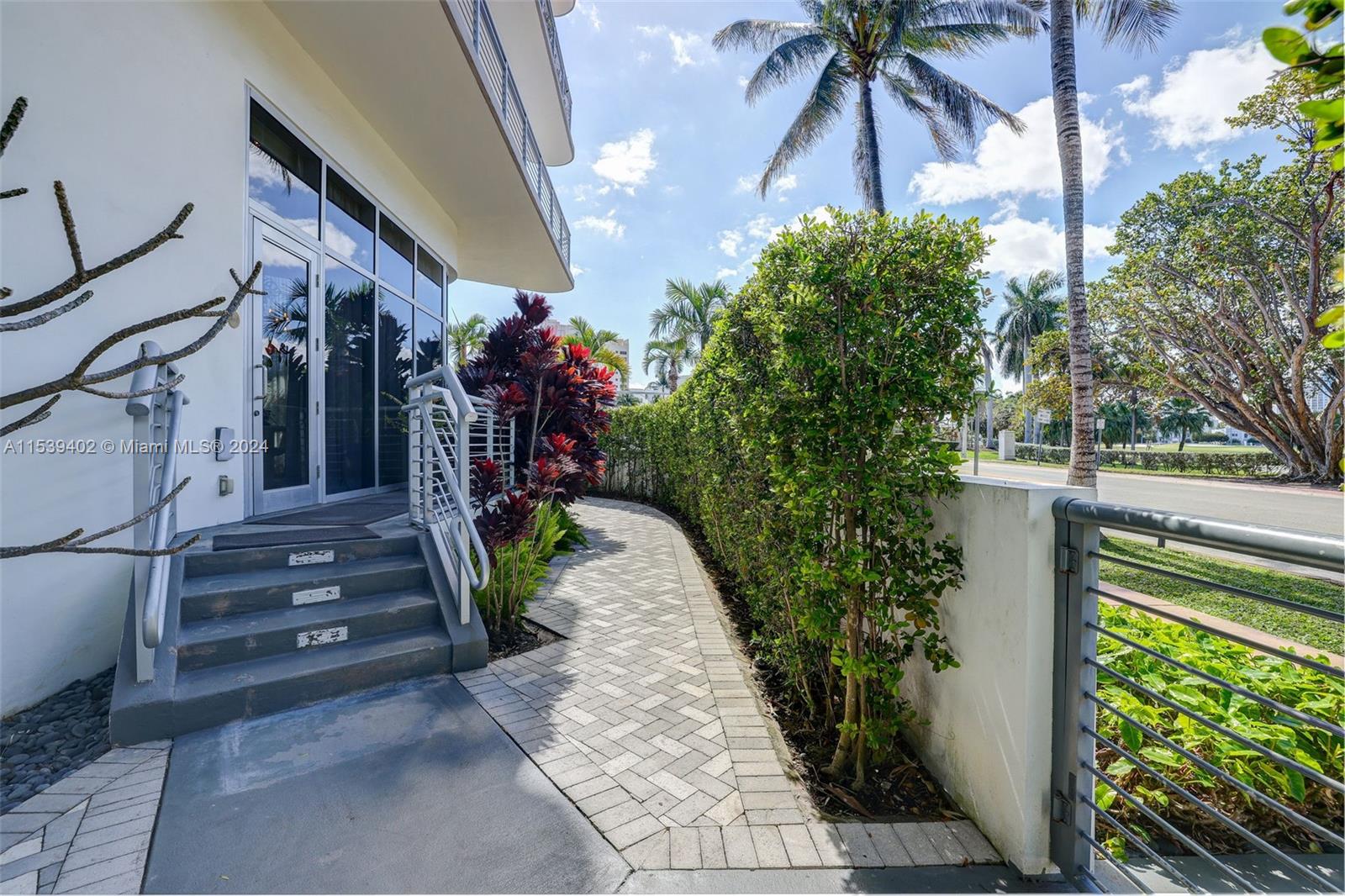 2001 Meridian Avenue, Unit 101 Miami Beach, FL 33139 - Photo 3 of 66 a view of a house with a flower garden