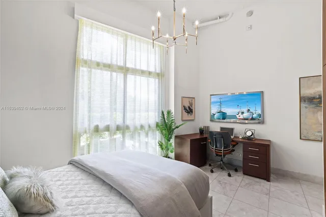 a room with a mirror and a shower