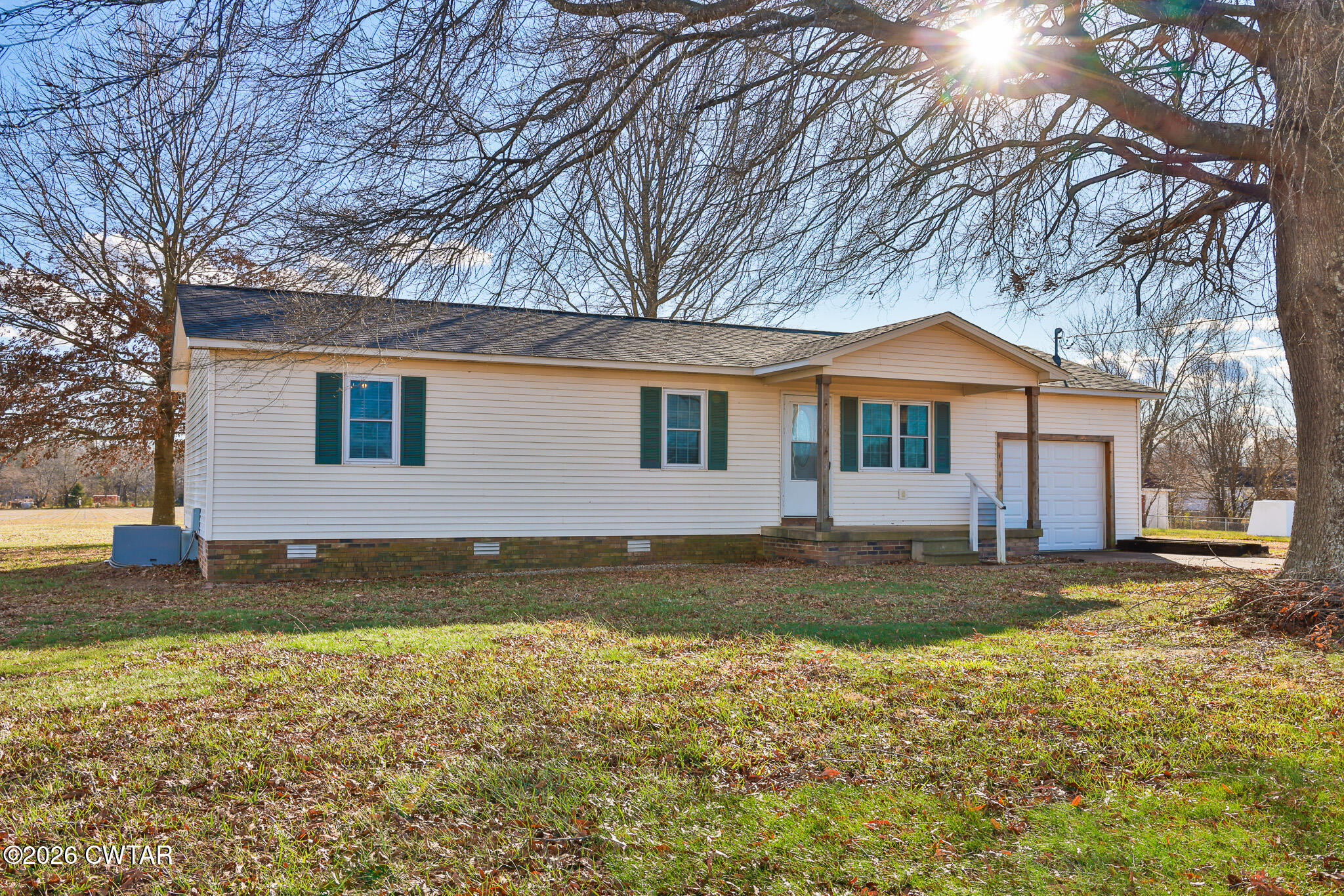 180 Everett Road McKenzie, TN 38201 - Photo 18 of 27 a front view of a house with a yard