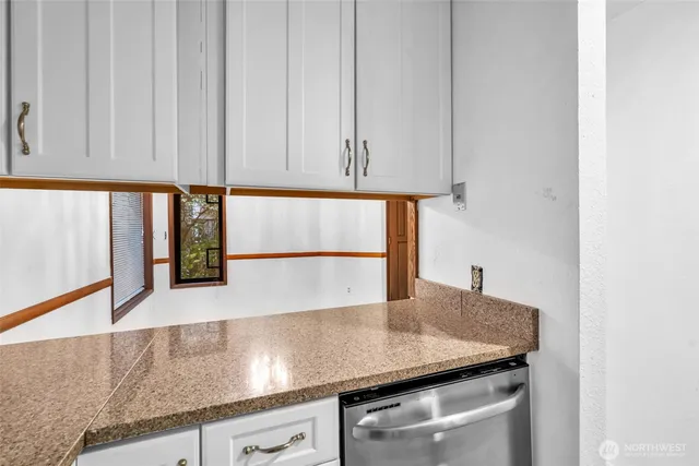 a kitchen with a sink and cabinets