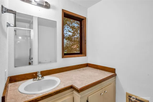 a bathroom with a sink and a mirror