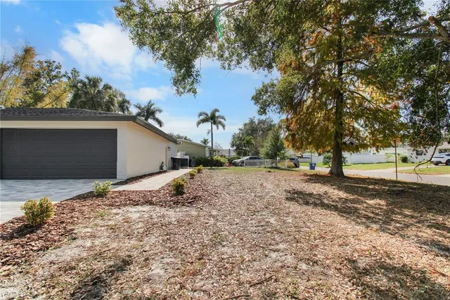 a backyard of a house with lots of green space