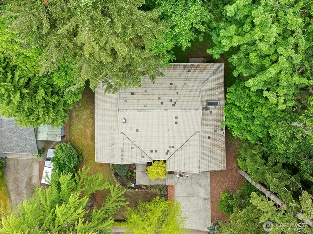 an aerial view of a house with an outdoor space