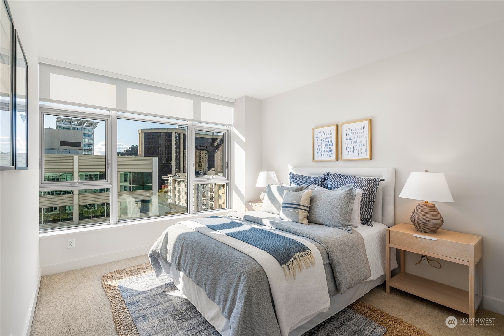 583 Battery Street, Unit 812N Seattle, WA 98121 - Photo 11 of 37 a bedroom with bed and a large window