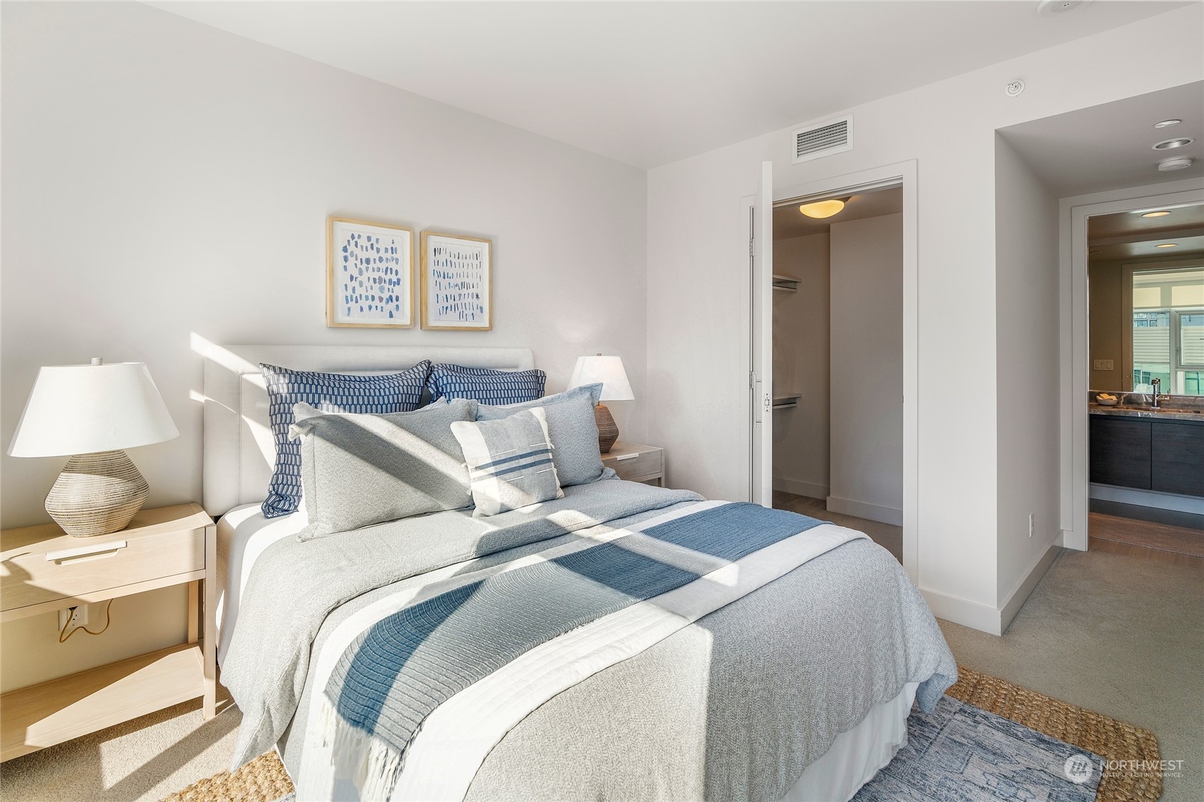 583 Battery Street, Unit 812N Seattle, WA 98121 - Photo 12 of 37 a bedroom with bed and a view of bathroom