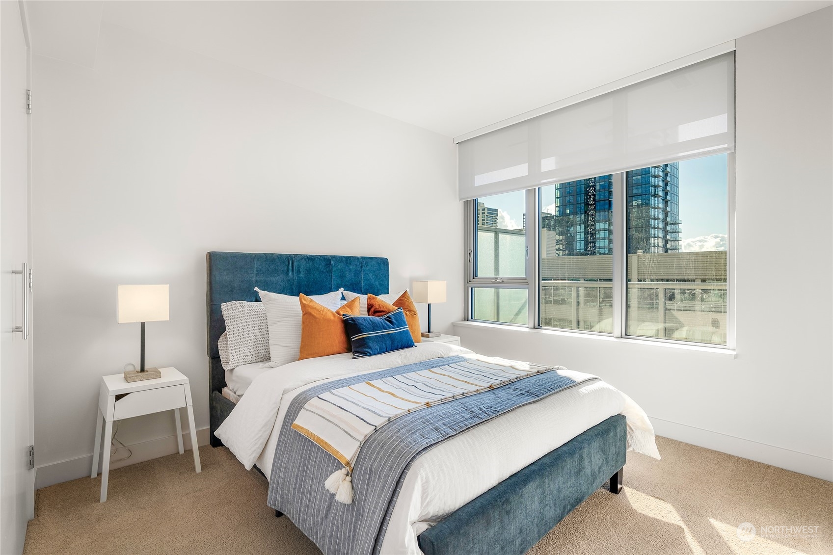 583 Battery Street, Unit 812N Seattle, WA 98121 - Photo 13 of 37 a bedroom with a bed and a large window