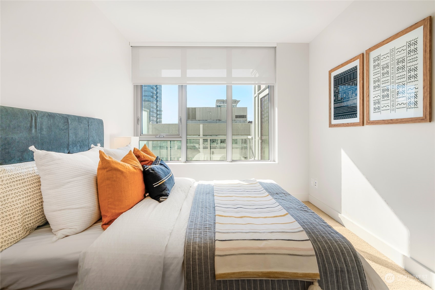 583 Battery Street, Unit 812N Seattle, WA 98121 - Photo 14 of 37 a bed sitting in a bedroom next to a window