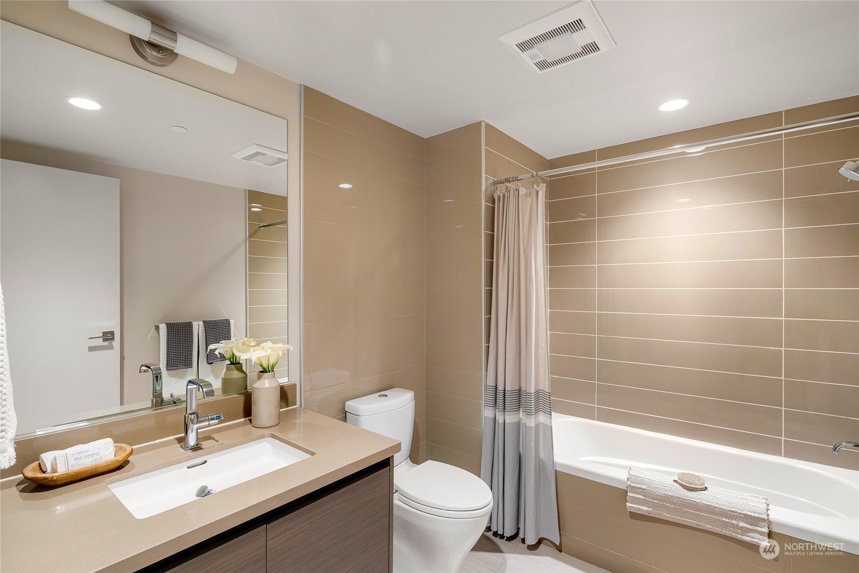 583 Battery Street, Unit 812N Seattle, WA 98121 - Photo 16 of 37 a bathroom with a sink toilet tub and shower