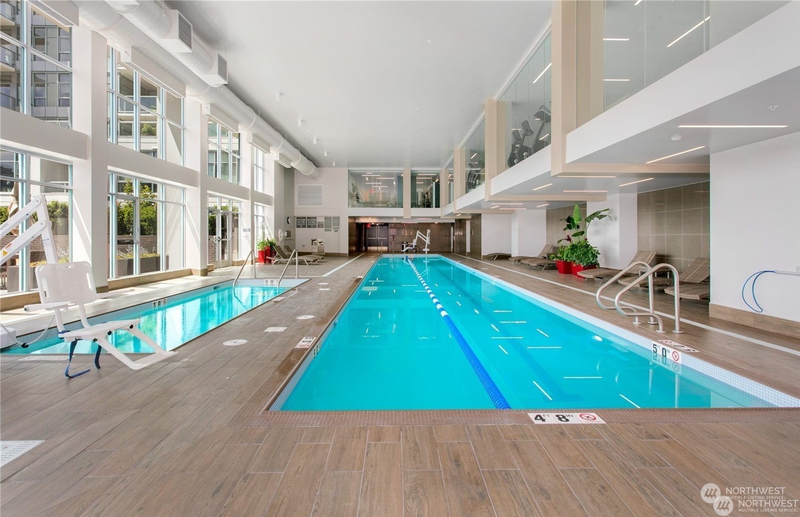 583 Battery Street, Unit 812N Seattle, WA 98121 - Photo 30 of 37 a view of a swimming pool with a lounge chairs