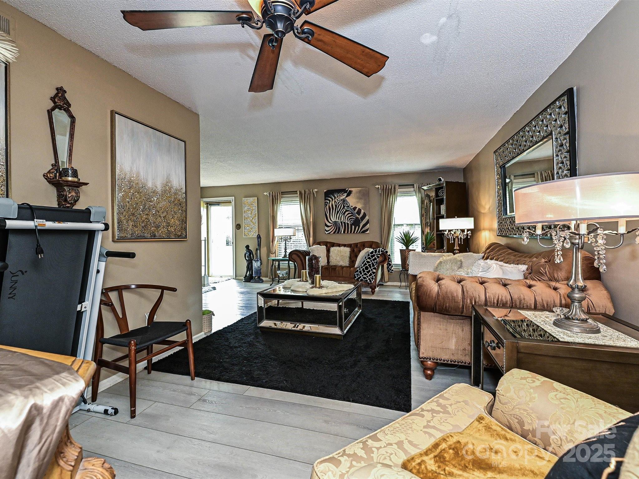4520 Central Avenue, Unit H Charlotte, NC 28205 - Photo 12 of 28 a living room with furniture and a view of kitchen