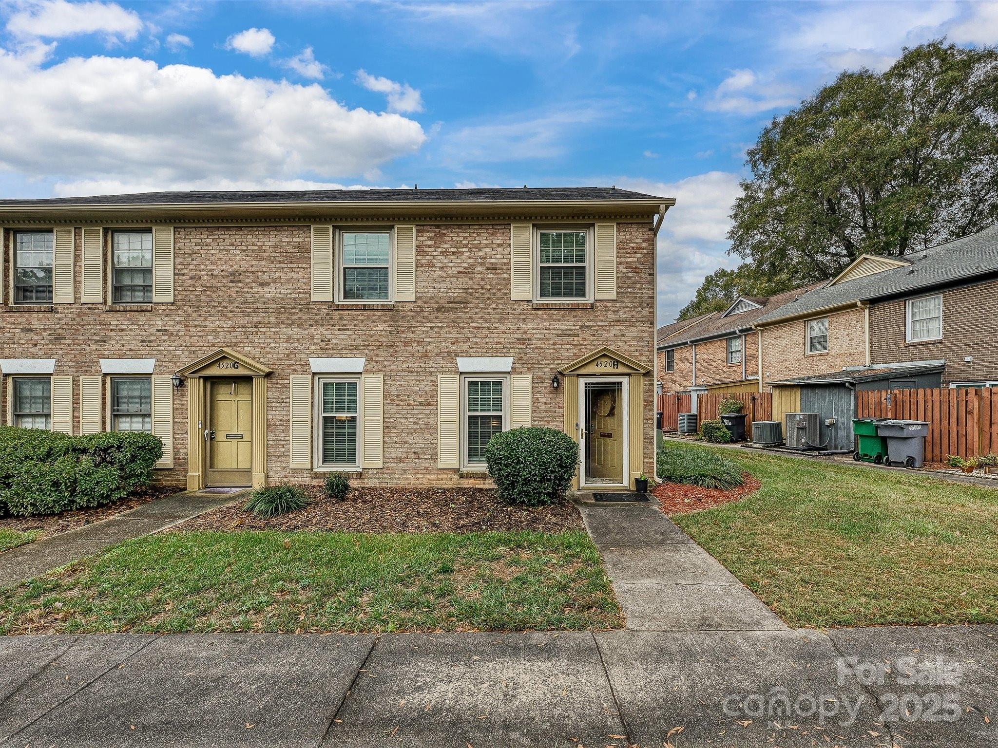 4520 Central Avenue, Unit H Charlotte, NC 28205 - Photo 2 of 28 a front view of a house with garden