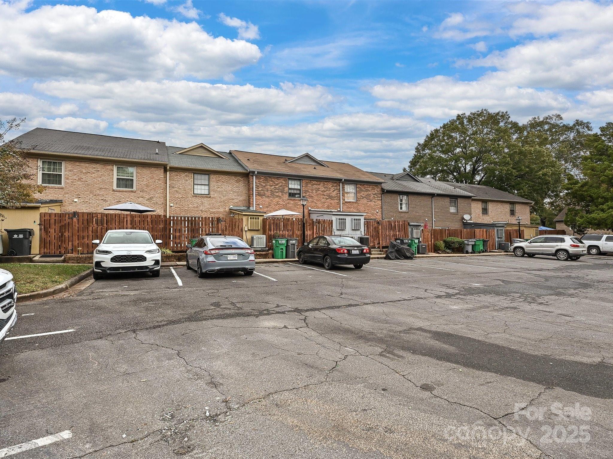 4520 Central Avenue, Unit H Charlotte, NC 28205 - Photo 27 of 28 a city street with cars parked in front of it