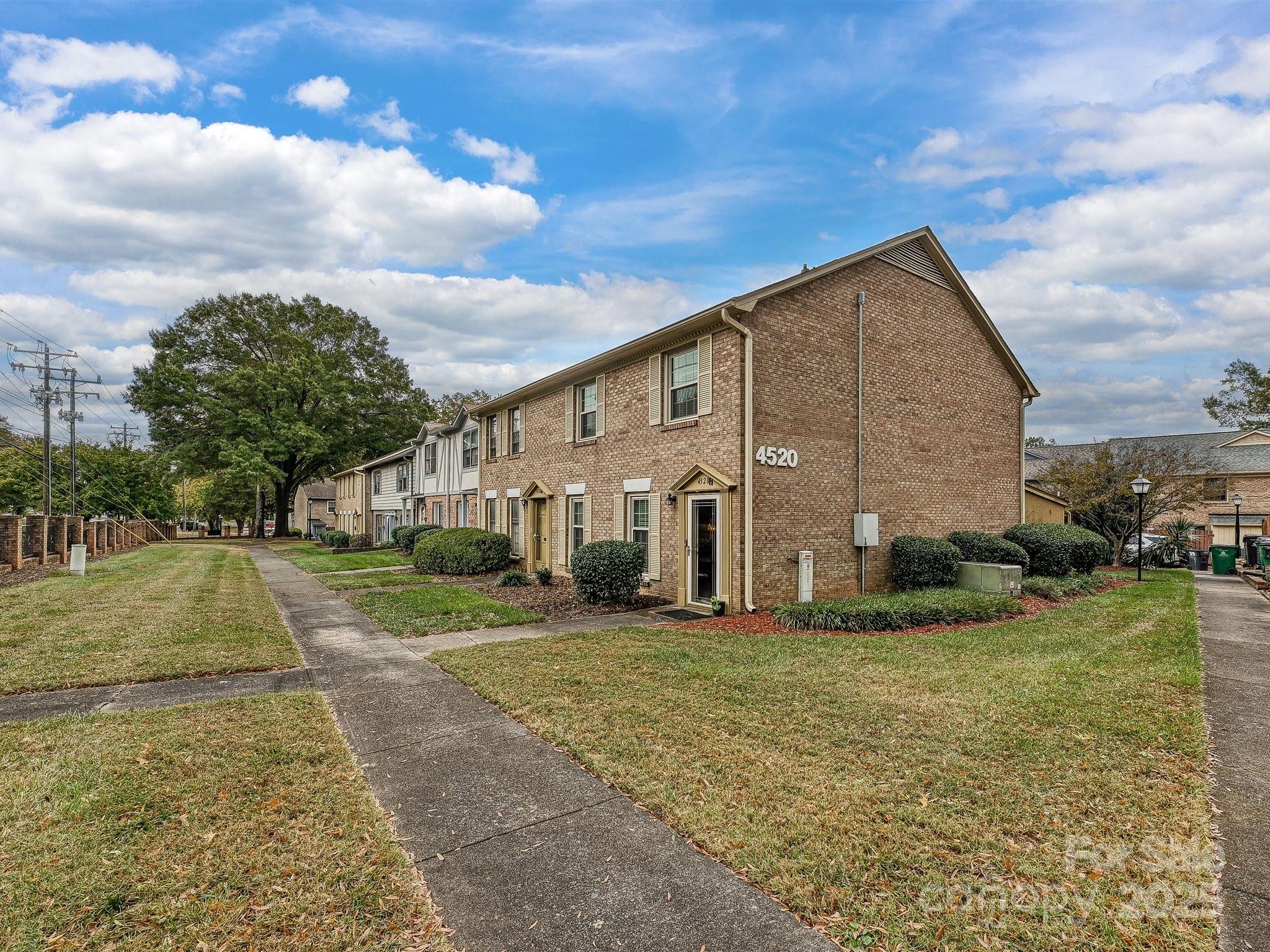 4520 Central Avenue, Unit H Charlotte, NC 28205 - Photo 28 of 28 a view of a house with a yard