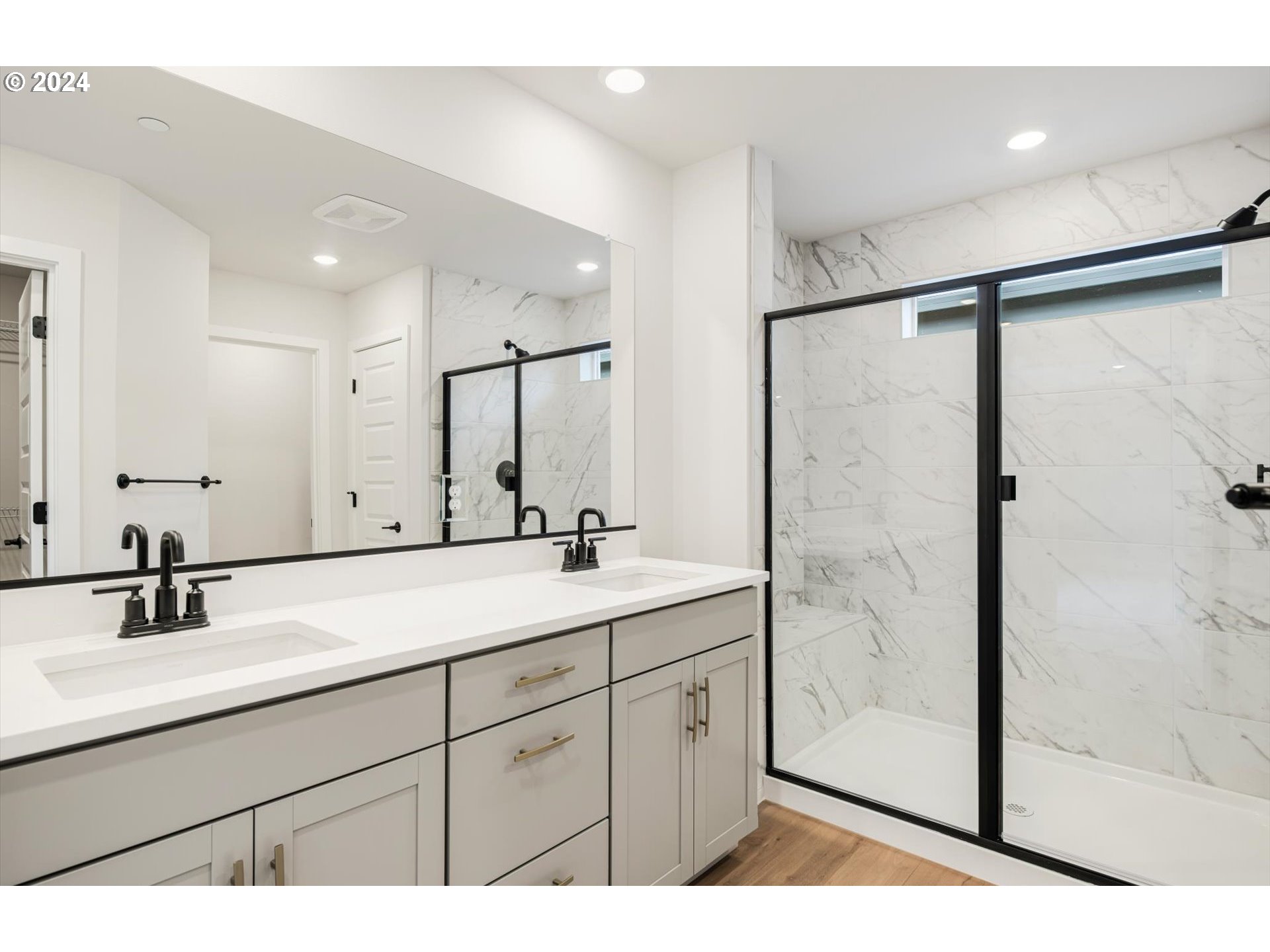 3865 West 4th Street Washougal, WA 98671 - Photo 11 of 24 a bathroom with a double vanity sink a mirror a shower and vanity