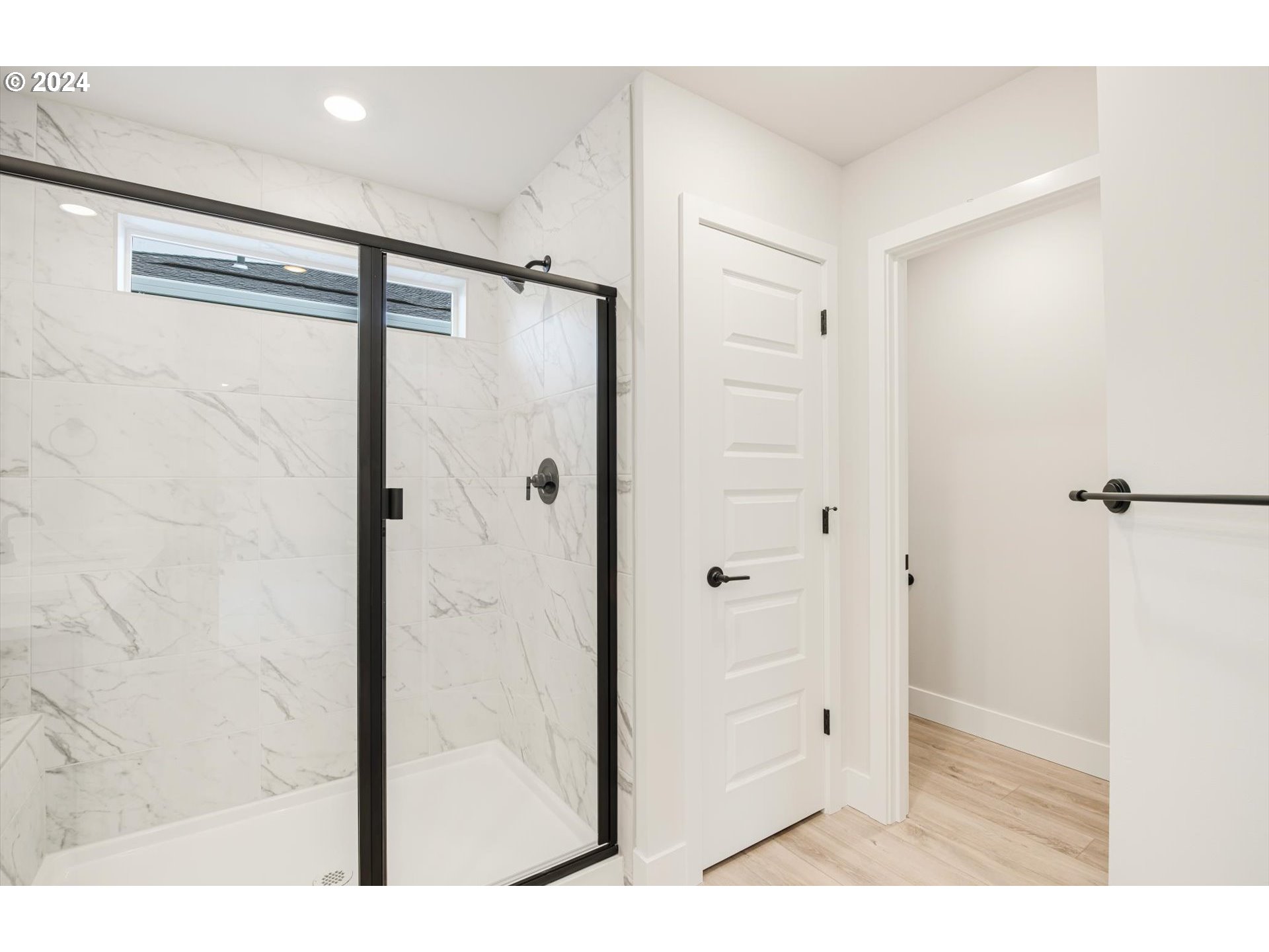 3865 West 4th Street Washougal, WA 98671 - Photo 12 of 24 a bathroom with a shower and a glass door