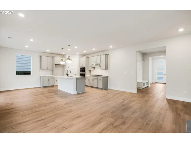 a view of kitchen with sink and wooden floor