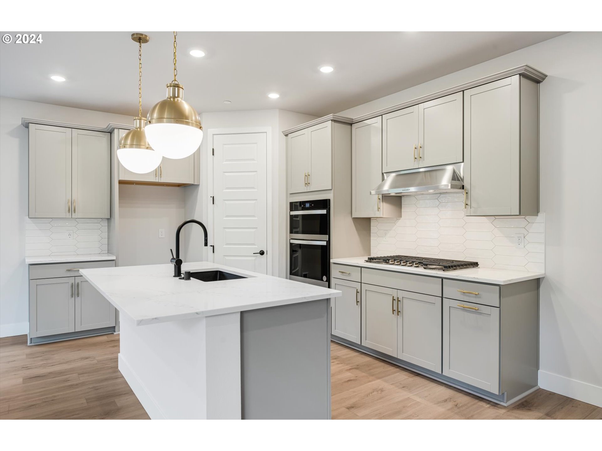 3865 West 4th Street Washougal, WA 98671 - Photo 5 of 24 a kitchen with stainless steel appliances granite countertop a sink stove and refrigerator