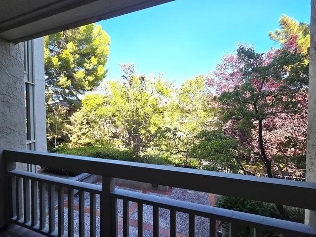 a lobby with furniture and a potted plant