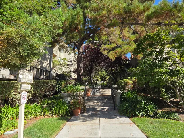 a balcony with wooden floor and outdoor space