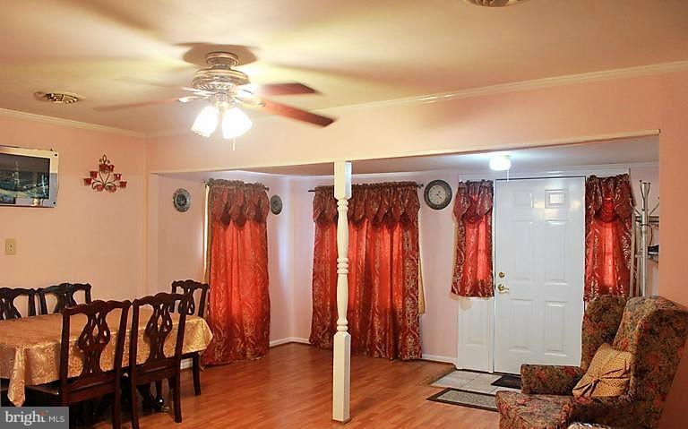 17762 Possum Point Road Dumfries, VA 22026 - Photo 6 of 13 a view of a room with furniture and wooden floor