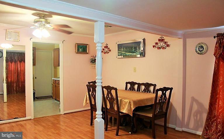 17762 Possum Point Road Dumfries, VA 22026 - Photo 7 of 13 a view of a dining room with furniture and wooden floor
