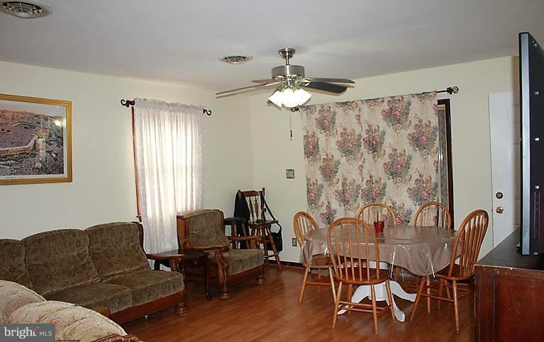 17762 Possum Point Road Dumfries, VA 22026 - Photo 8 of 13 a living room with furniture and wooden floor