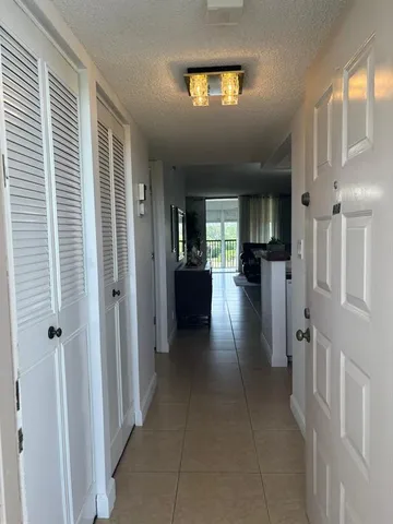 a view of a hallway view with living room