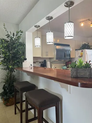 a kitchen with a table and chairs in it