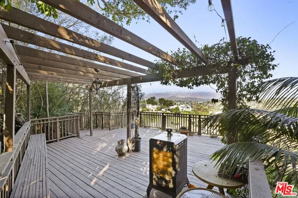 a view of a chairs and tables in the balcony