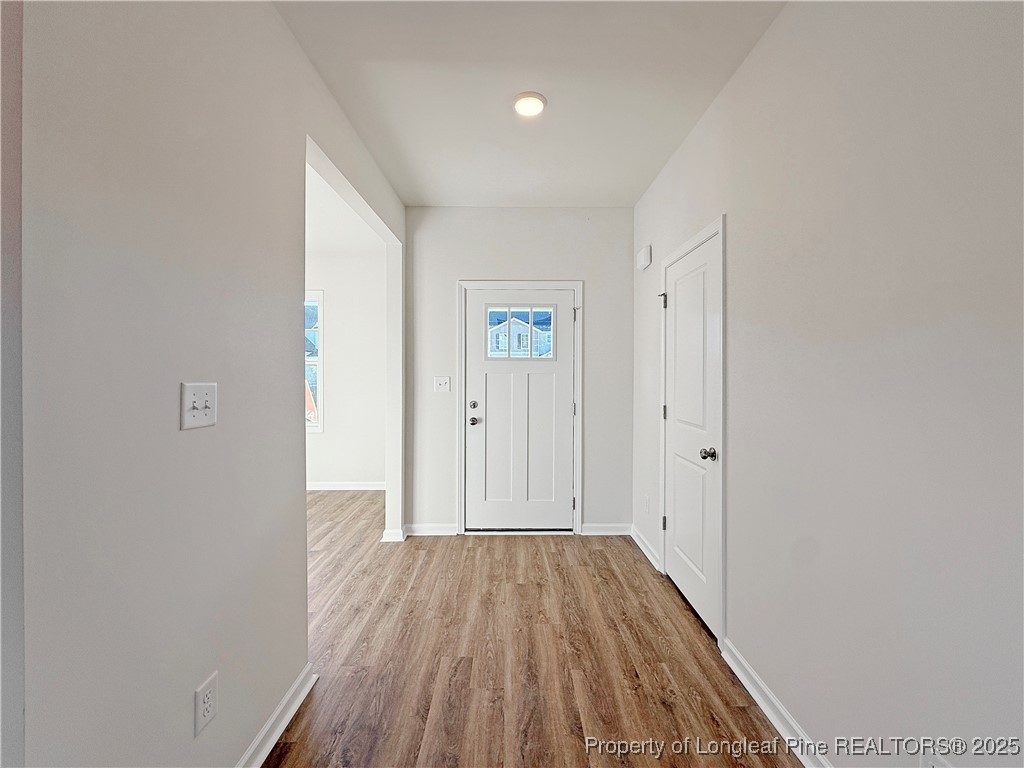 514 Ashley Heights Raeford, NC 28376 - Photo 2 of 39 a view of a hallway with wooden floor