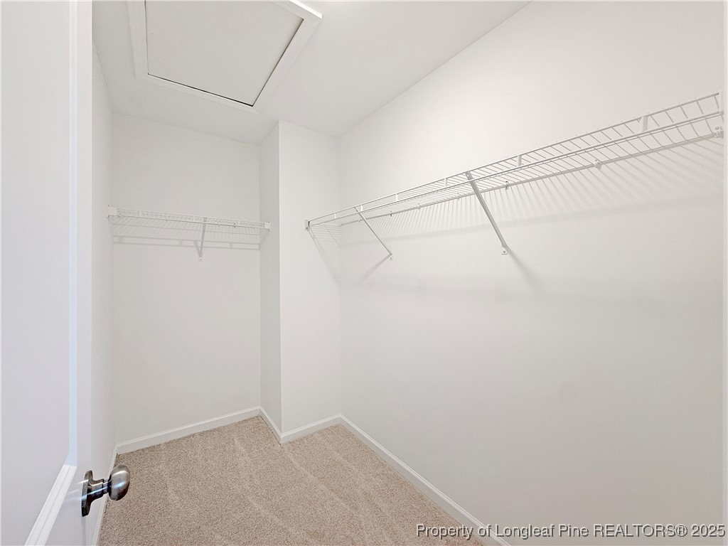 514 Ashley Heights Raeford, NC 28376 - Photo 24 of 39 a view of a room with racks on the wall