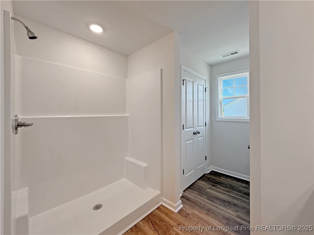 514 Ashley Heights Raeford, NC 28376 - Photo 27 of 39 a bathroom with a tub and shower