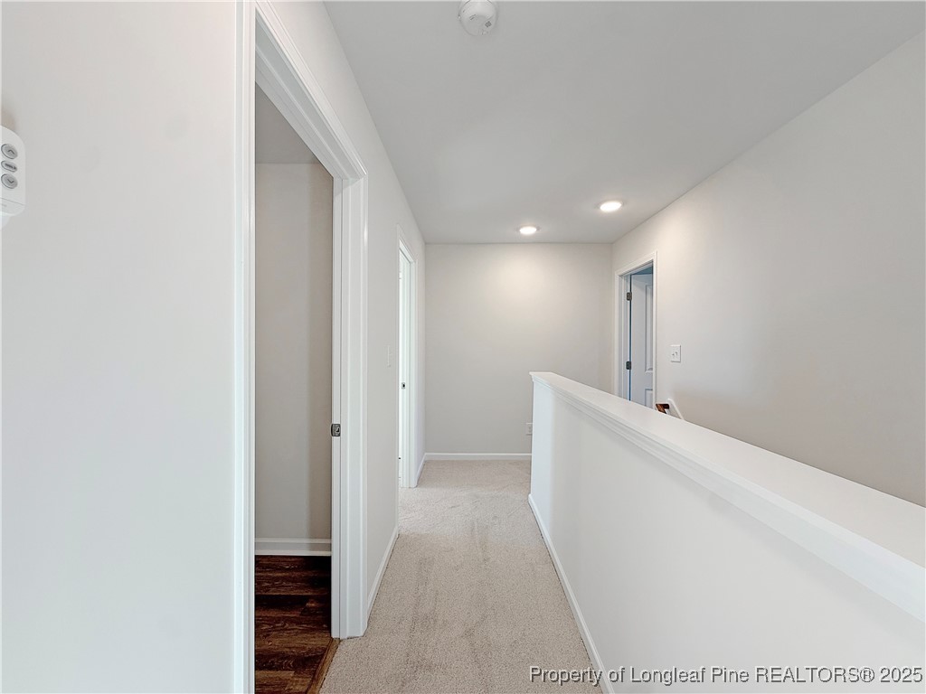 514 Ashley Heights Raeford, NC 28376 - Photo 29 of 39 a view of hallway with stairs and a couch