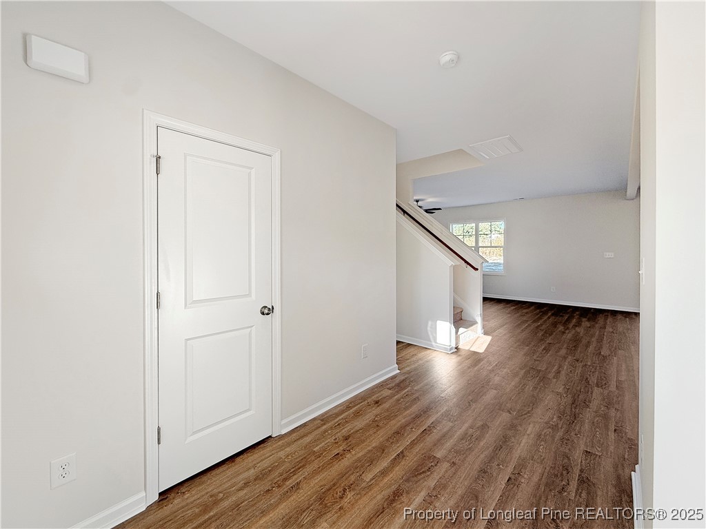 514 Ashley Heights Raeford, NC 28376 - Photo 3 of 39 a view of a hallway with wooden floor